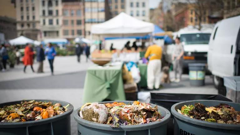 Bins to collect food scraps for compost at Union Square Greenmarket in Manhattan, New York City.