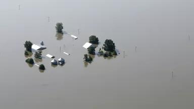 An aerial view of a flooded farm near the Mississippi River