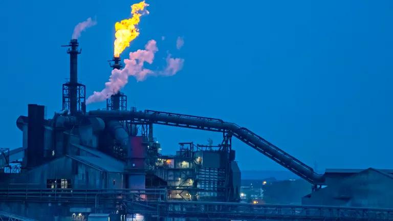 The ArcelorMittal steel mill in Cleveland, Ohio, light up the evening sky on July 19, 2018.