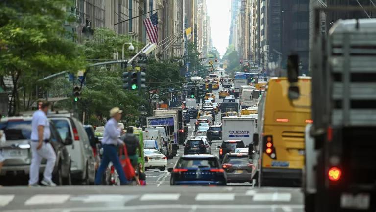 Pedestrians cross in front of traffic in New York City.