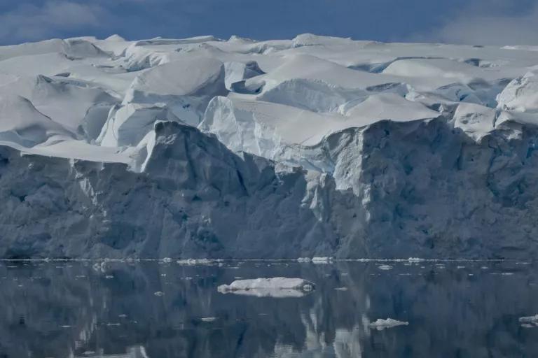 The edge of a glacier rises out of icy water