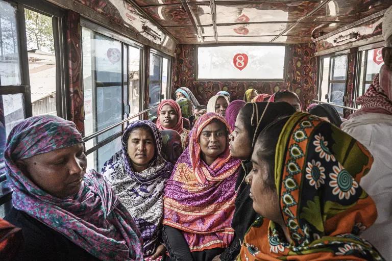 A group of women riding in a bus