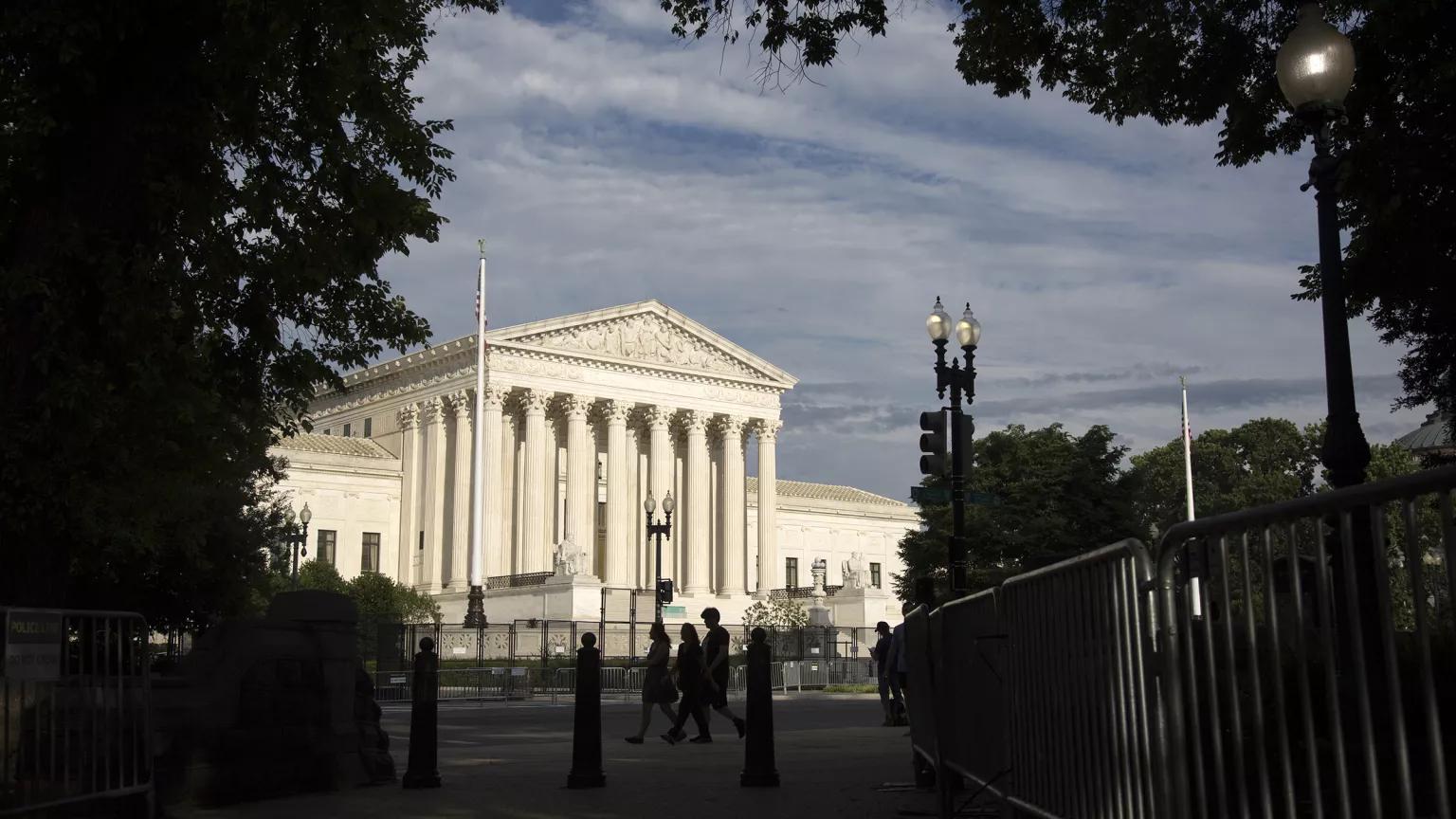 Pedestrians walking past the U.S. Supreme Court