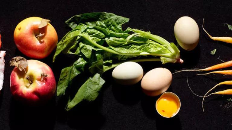 Vegetables and fruit including carrots, apples, and eggs