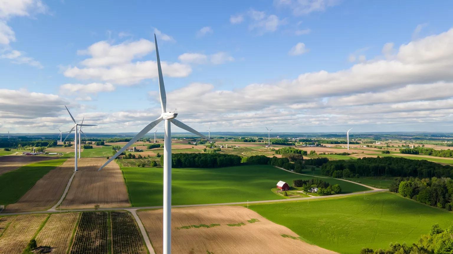 An aerial view of turbines above farm fields at Stoney Corners Wind Farm in Michigan