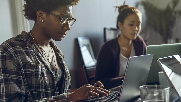 Two women working at computers